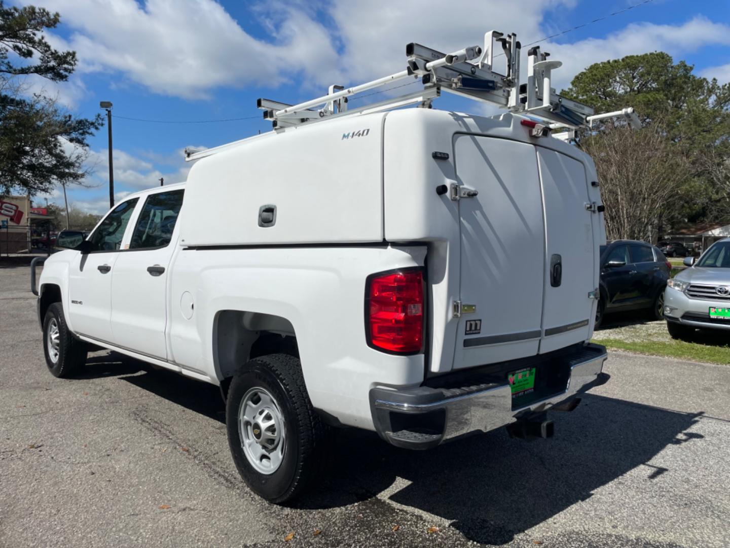 2015 WHITE CHEVROLET SILVERADO 2500H WORK TRUCK (1GC1KUEG7FF) with an 6.0L engine, Automatic transmission, located at 5103 Dorchester Rd., Charleston, SC, 29418-5607, (843) 767-1122, 36.245171, -115.228050 - Local Trade-in with Easy Clean Vinyl Interior, Backup Camera, AM/FM/AUX, Spacious Rear Seat, Power Windows, Power Locks, Power Mirrors, Utility Cab with Storage All Around, Pull Out Bed Storage, Ladder Rack, Safety Strobe Lights, Keyless Entry, Tow Package with Brake Assist, 4-Wheel Drive, Brush Gua - Photo#4